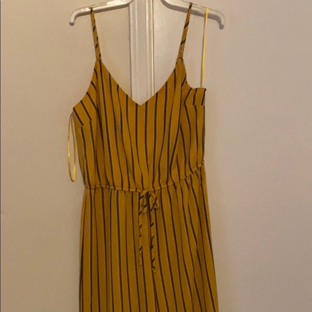 Yellow jumpsuit with black stripes